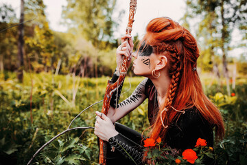 Girl in ethnic scandinavian costume in the forest