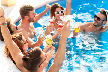 Group of friends have pool party.