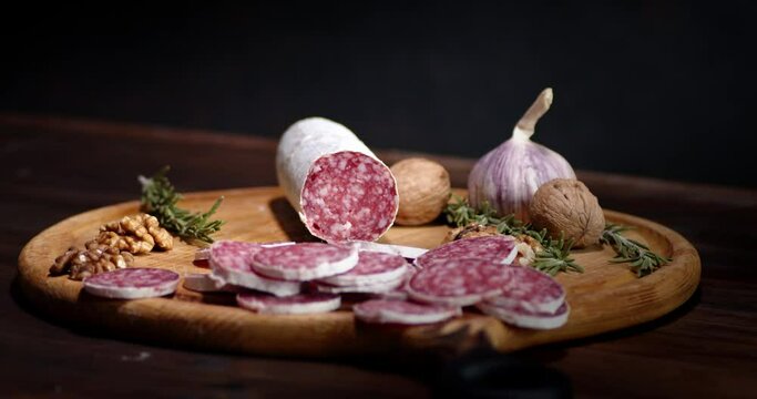 Salami with walnuts,rosemary and garlic slowly rotate.