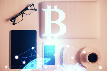Double exposure of blockchain theme hologram over table with phone. Top view. Crypto technology concept.