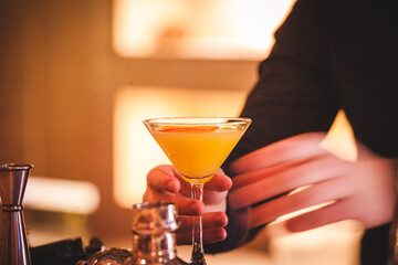 young woman drinking cocktail
