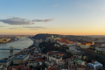 Obraz premium Aerial drone shot of Buda castle on hill during Budapest sunset hour