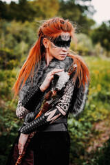 Fototapeta na wymiar Girl in ethnic scandinavian costume in the forest