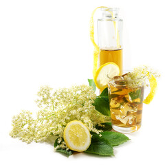 Homemade elderberry flower syrup in a bottle and lemonade drink in a glass, lemon zest and some...