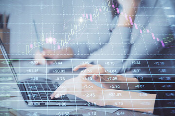 Multi exposure of woman hands typing on computer and financial chart hologram drawing. Stock market analysis concept.
