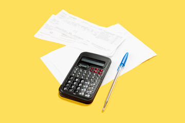 tax bill calculating isolated on a yellow background. tax planning concept. money saving concept.