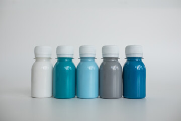 Set of colorful gouache paints on white background. Children's drawing