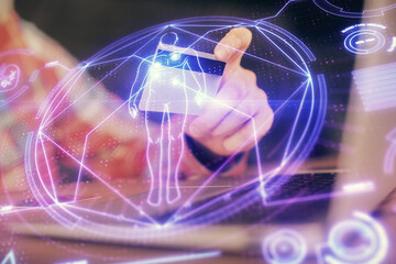 Double exposure of man hands holding a credit card and education theme drawing. On-line study and E-commerce concept.