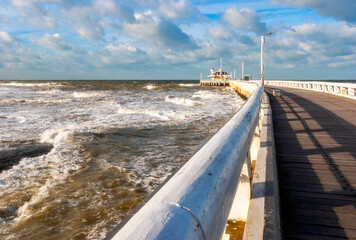 The pier of Oostende (Ostend) in storm weather with strong North Sea waves, West Flanders, Belgium.