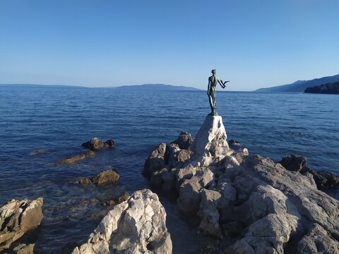 Lady with seagull in Opatija, most popular trademark of city.