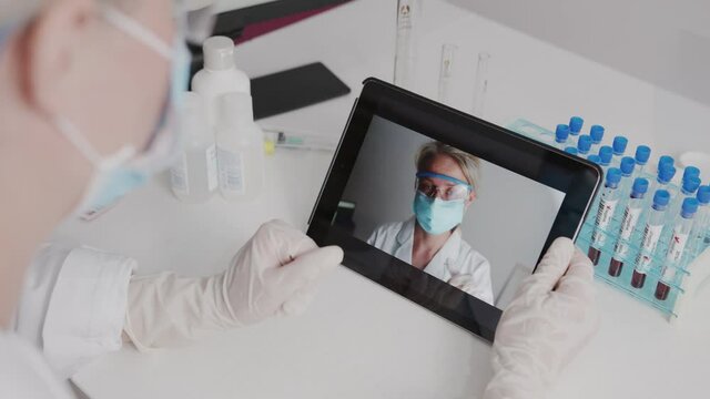 doctor speaks on video call with colleagues relatives online conference during a pandemic. quarantine, coronavirus, covid 19