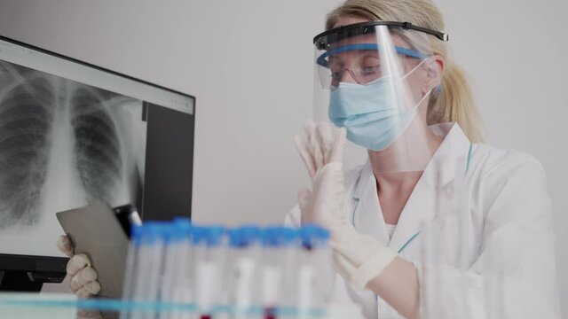 doctor speaks on video call with colleagues relatives online conference during a pandemic. quarantine, coronavirus, covid 19