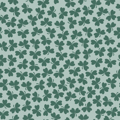 Fototapeta premium Green clover leaves mosaic texture isolated on white background. Happy St. Patrick's Day shamrock wallpaper. Seamless pattern. Abstract geometric shapes vector illustration