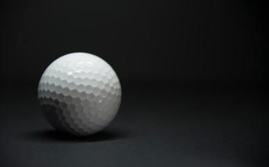 golf ball on black background