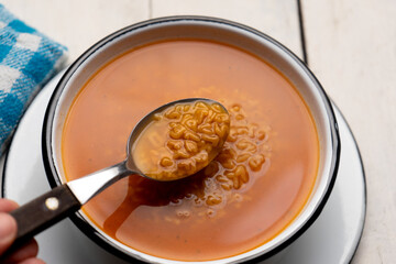 Alphabet soup pasta on white background