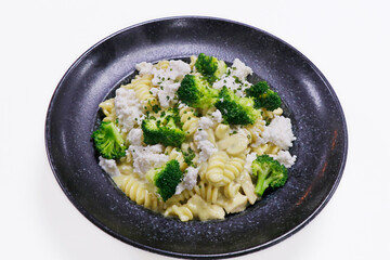 fusilli pasta with chicken, mushroom and broccoli in rich creamy sauce