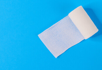 
one medical and sterile bandage on the right and with place for text on the left, top view close-up.