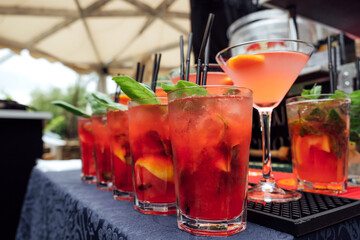red cocktails stand on the table