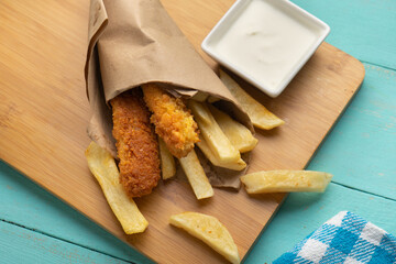 British fish and chips on turquoise background