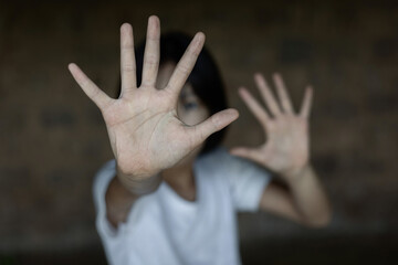Child showing hand for Stop violence and abused children concept.