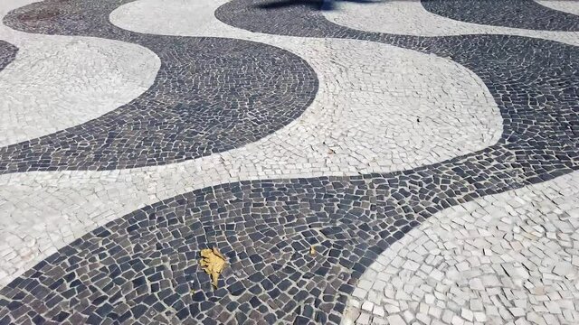 Classic mosaic on the Copacabana beach boardwalk in Rio de Janeiro, Brazil