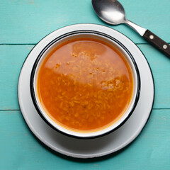 Alphabet soup pasta on turquoise background