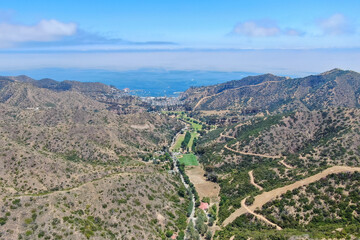 Fototapeta na wymiar Aerial view of Santa Catalina Island mountains and trails with ocean on the background. California, USA