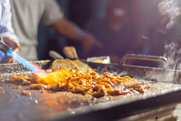 grilled squid burned by the flame gun