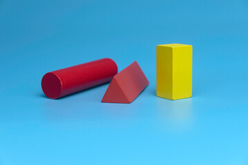 Selective focus of colorful various of shape isolated on a blue background.