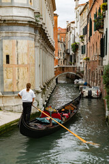 Fototapeta na wymiar Canals of Venice during the day in high resolution, vertical