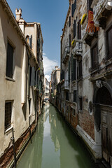 Obraz na płótnie Canvas Canals of Venice during the day in high resolution, vertical