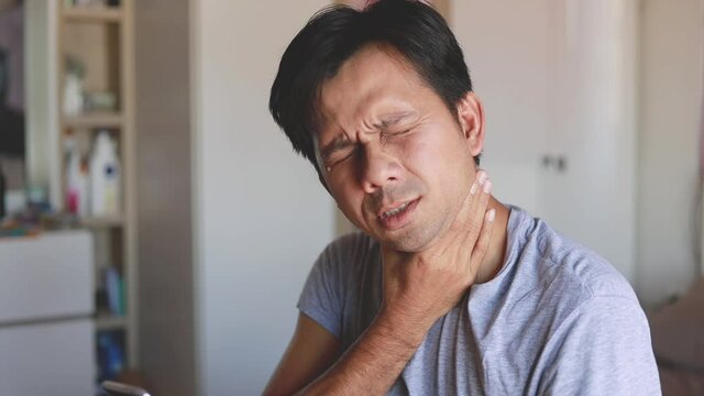 Young asian man had cough and sore throat. Health problem concept