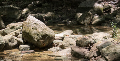 Fototapeta premium a rock filled stream bed
