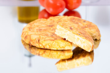 Freshly made spanish omelet with a slice taken out
