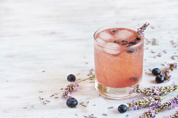 blueberries and lavender syrup Cold carbonated lemonade (soda) with . Soft focus. Place for text....