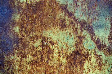 old worn iron sheet with multi-colored exfoliated scratched paint with different shades