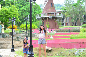 Little Girl and Mother at The Public Park