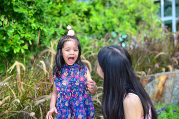 Little Girl and Mother at The Public Park