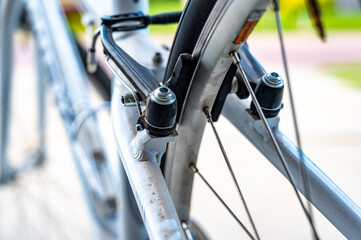 Selective focus on peddle bike brake pads on back tire rim