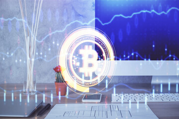 Double exposure of blockchain and crypto economy theme hologram and table with computer background....