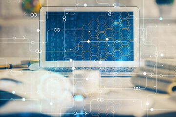 Multi exposure of desktop computer and technology theme hologram. Concept of software development.
