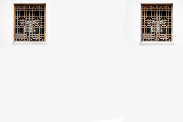 frame of the windows of the house on the white wall