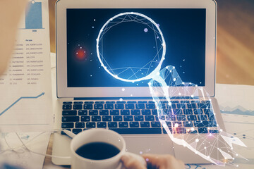 Desktop computer background in office and start up theme hologram drawing. Double exposure. Startup...