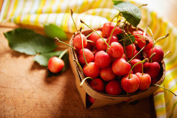 ripe cherries in a basket on the table