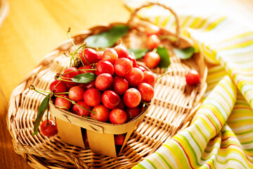 ripe cherries in a basket on the table