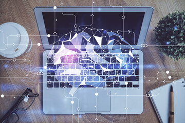 Multi exposure of work table with computer and brain hologram. Brainstorm concept.