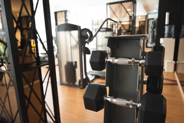 Black dumbbell in fitness healthy sport gym.