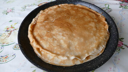 pancakes are stacked on the pan