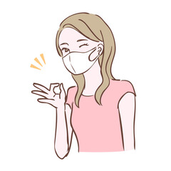 マスクをつけてオッケーサインをしている女性