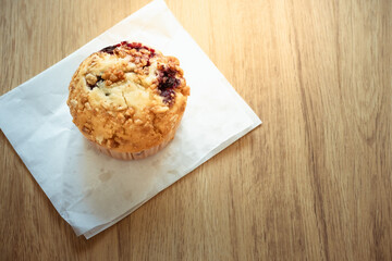 Muffin cake on wooden table use for background sweet food desserts on breakfast